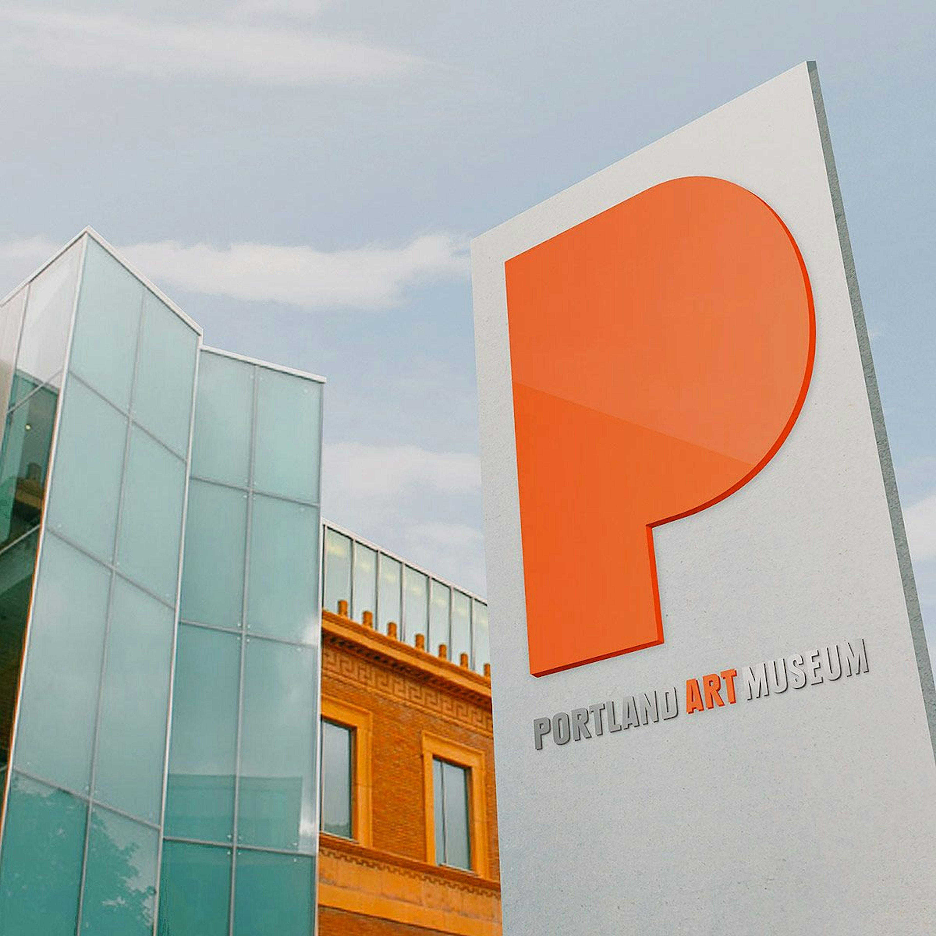 Portland Art Museum signage featuring a large, orange stylized P in front of the museum